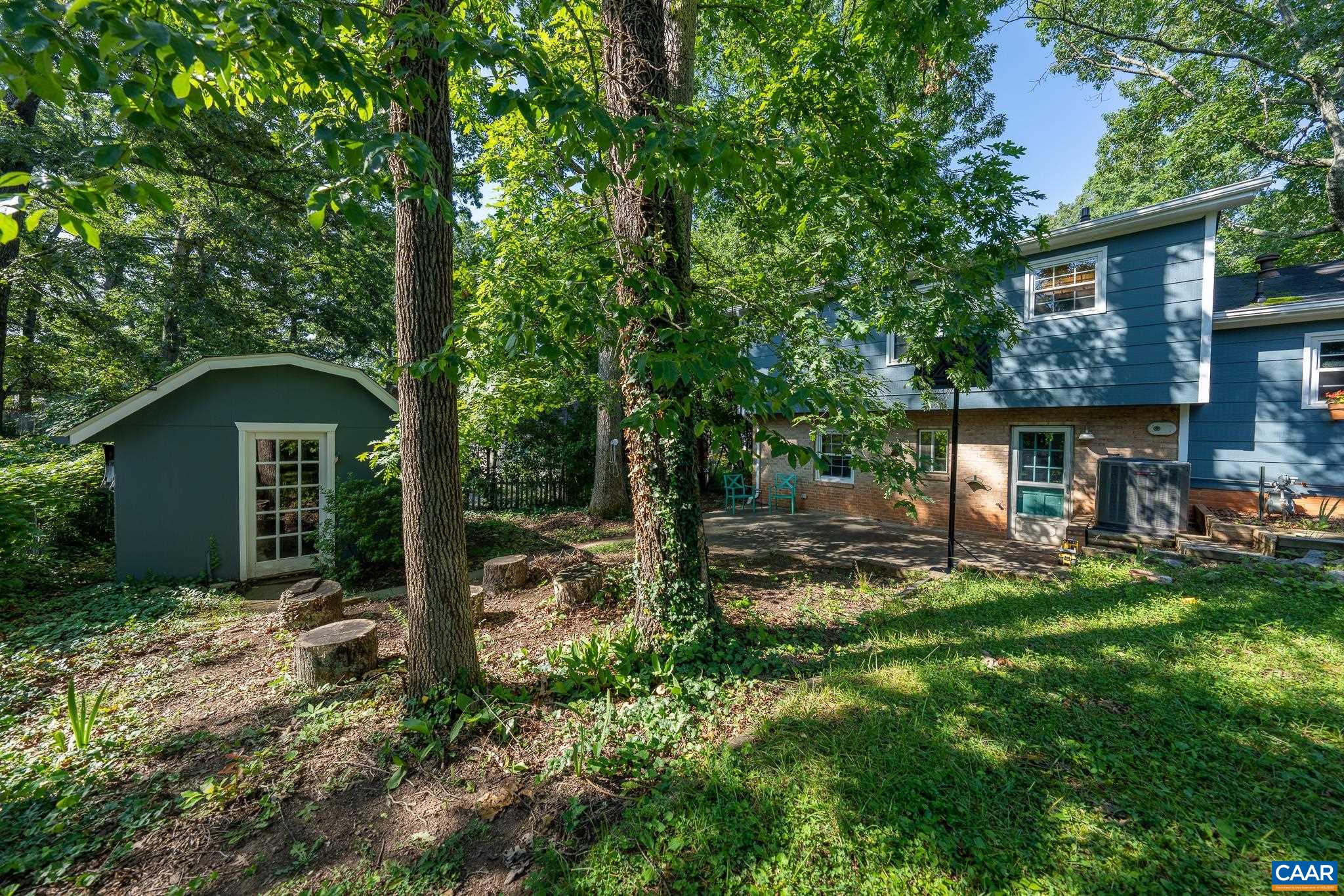 723 Village Road Charlottesville, VA 22903 - Photo 8 of 51 front view of a house with a yard
