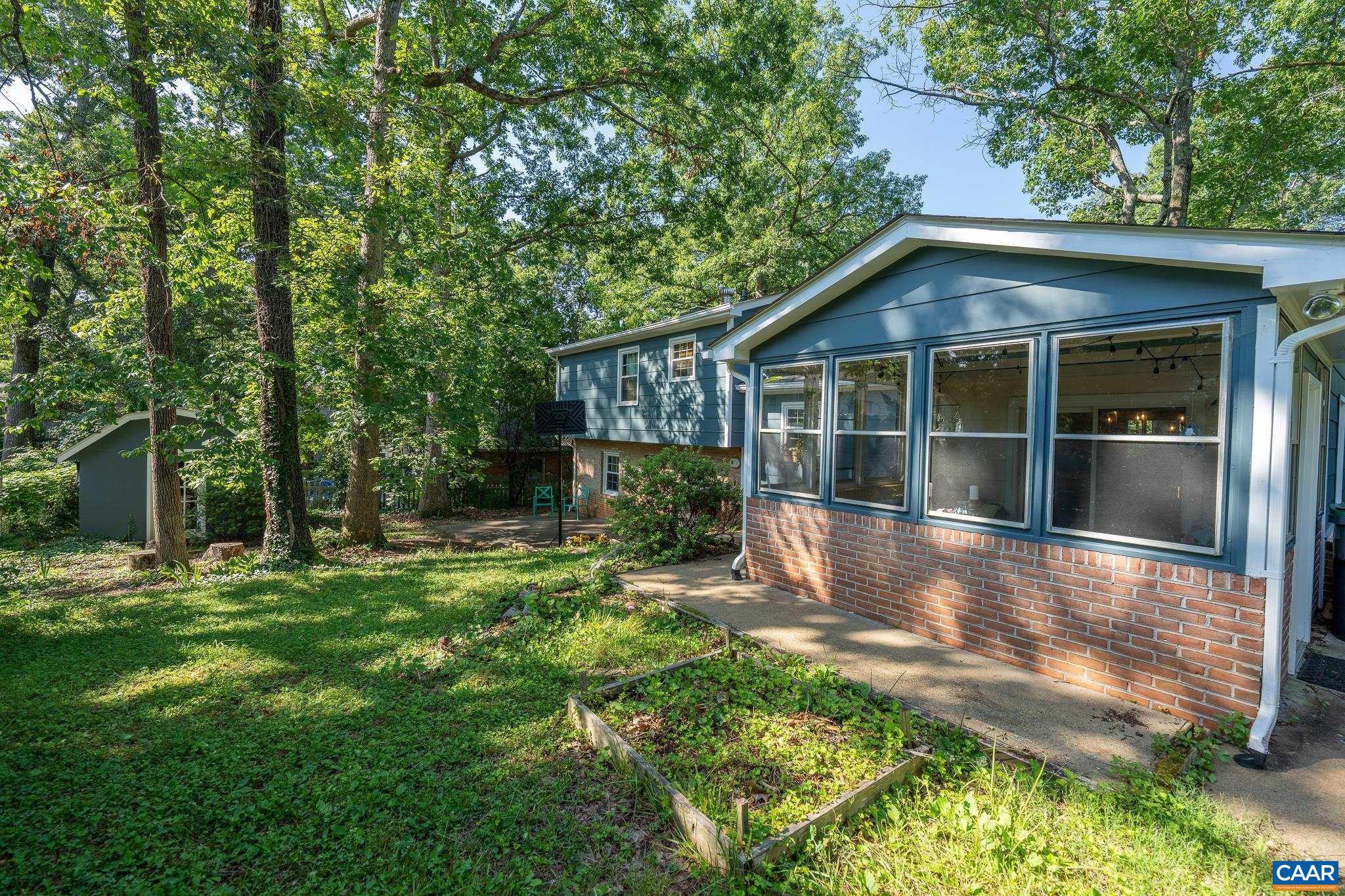 723 Village Road Charlottesville, VA 22903 - Photo 10 of 51 a view of a house with backyard and garden