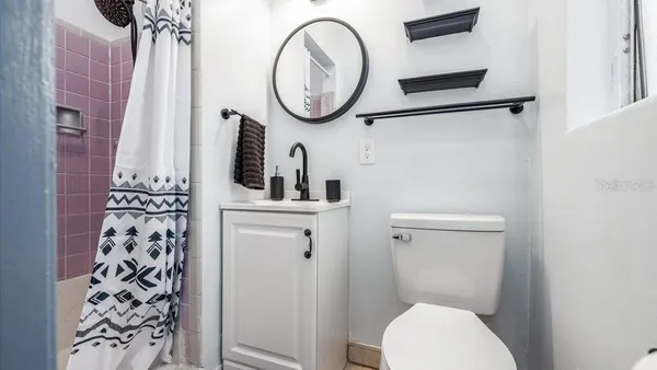 a bathroom with a toilet and a sink