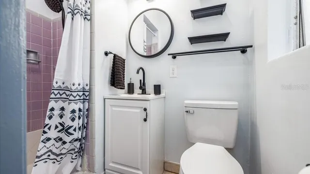 a bathroom with a toilet and a sink