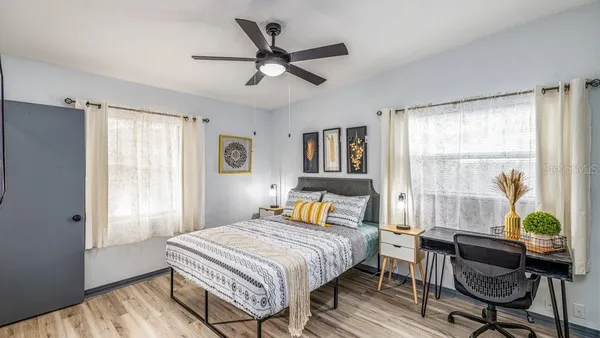 a bedroom with a bed and a window