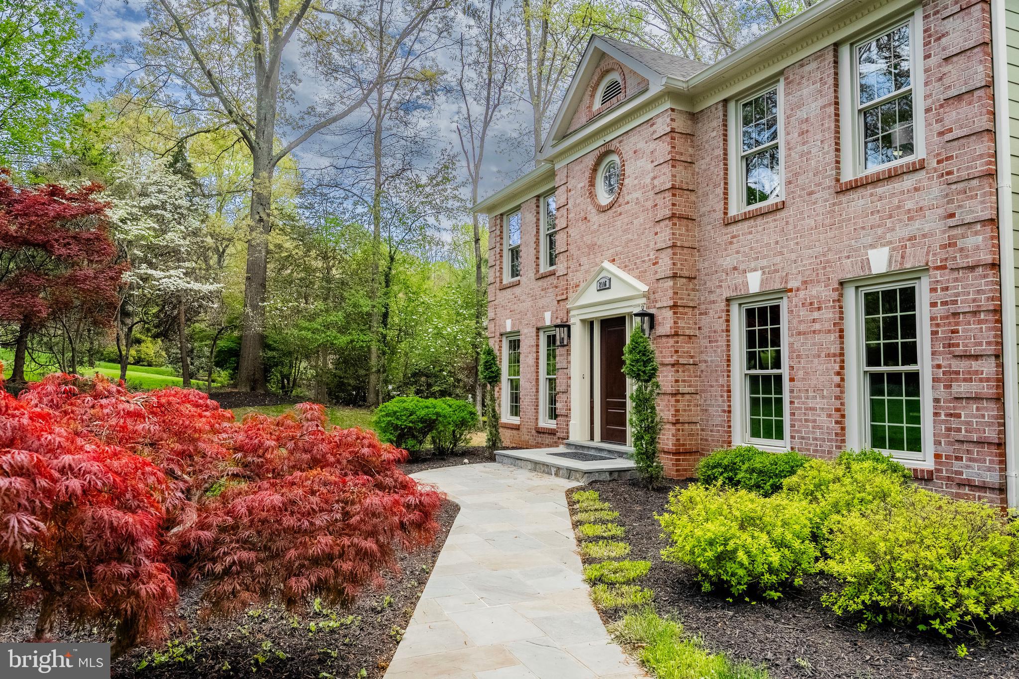 2906 Oakton Ridge Circle Oakton, VA 22124 - Photo 2 of 42 a view of a building with garden and patio