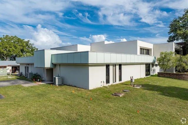 a view of a backyard of the house