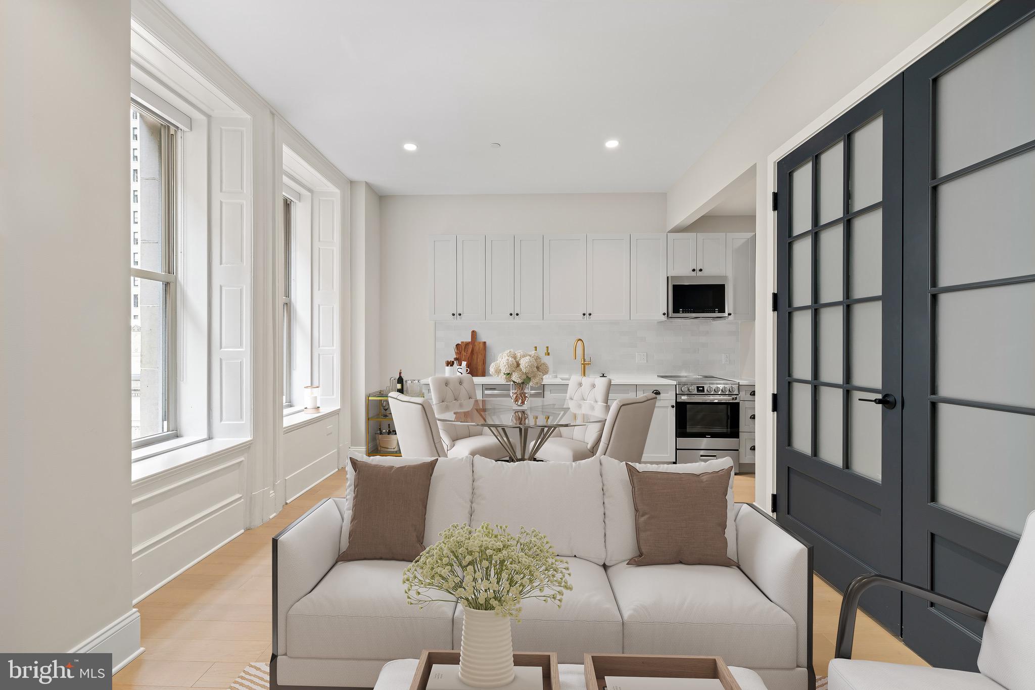 200 South Broad Street, Unit 1015 Philadelphia, PA 19102 - Photo 1 of 48 a living room with furniture and a window