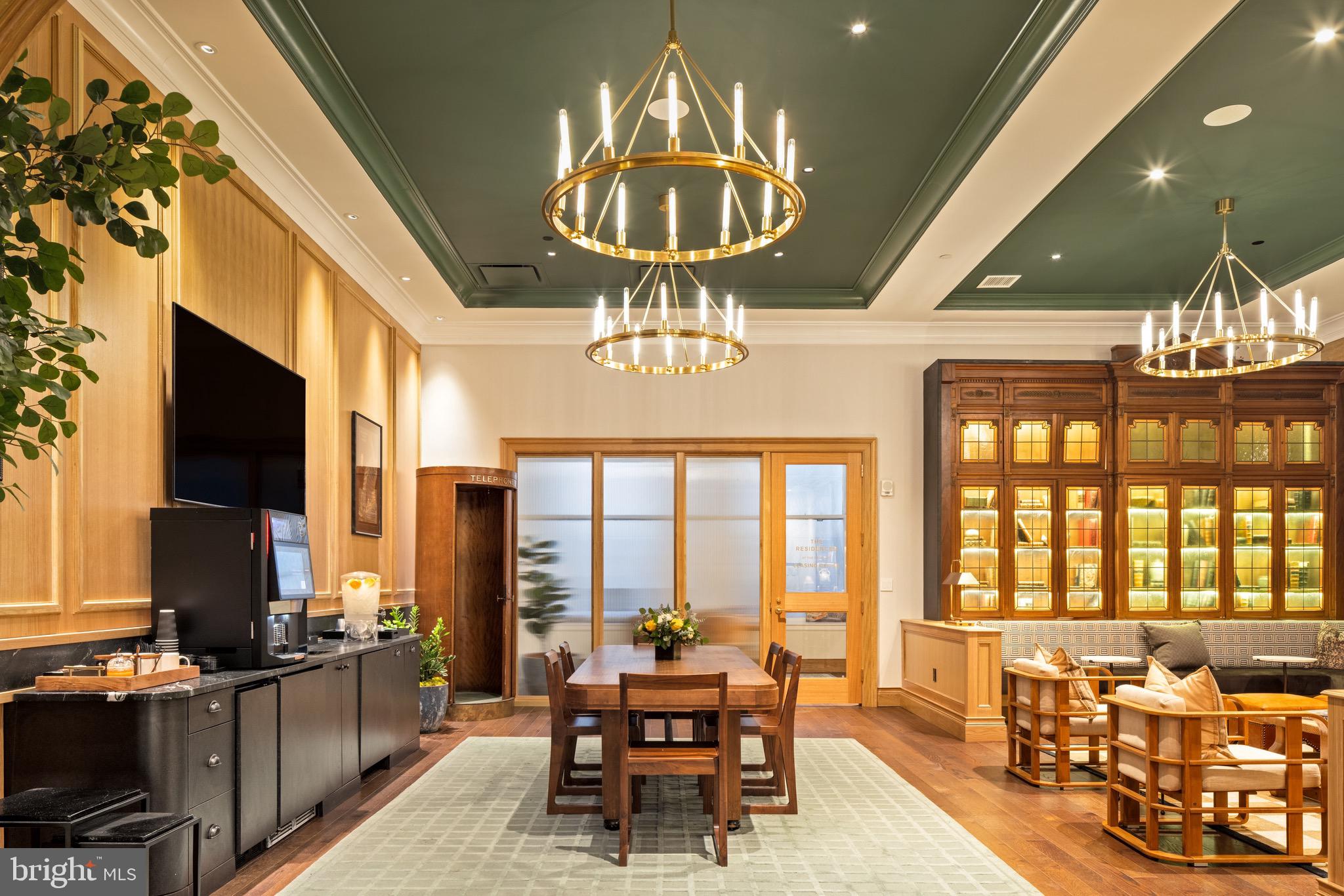 200 South Broad Street, Unit 1015 Philadelphia, PA 19102 - Photo 16 of 48 a dining room with wooden floor furniture and a chandelier