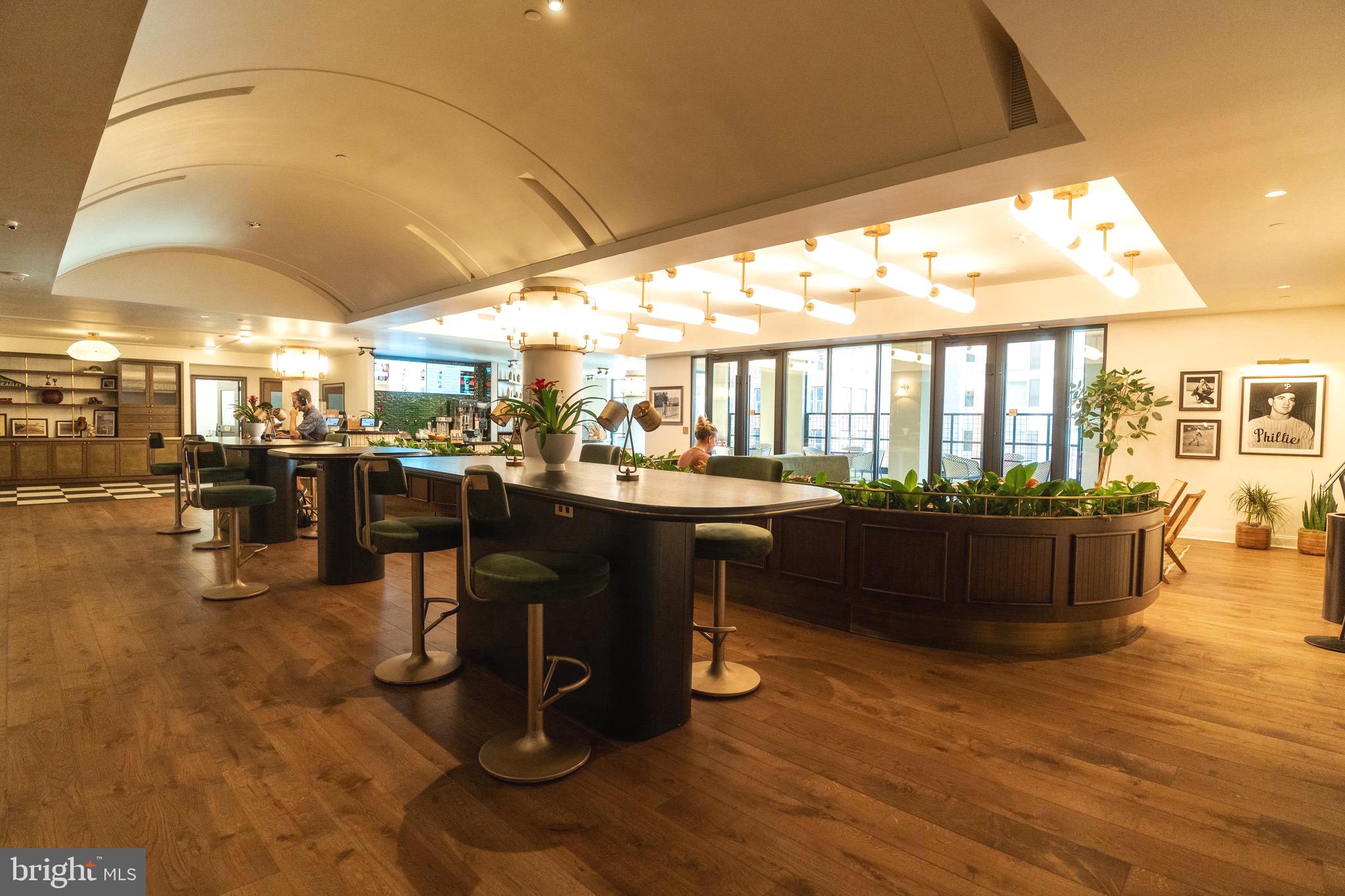 200 South Broad Street, Unit 1015 Philadelphia, PA 19102 - Photo 35 of 48 a room with lots of table and chairs