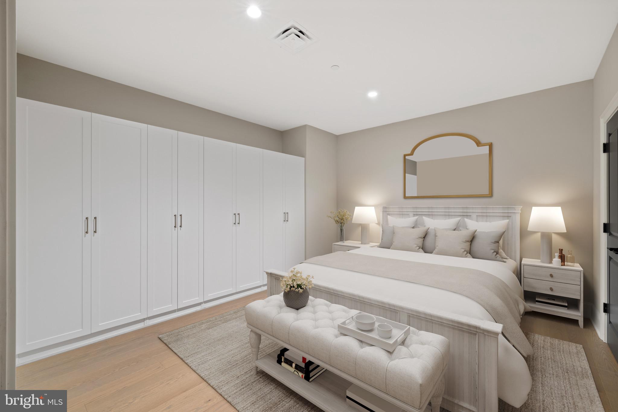 200 South Broad Street, Unit 1015 Philadelphia, PA 19102 - Photo 5 of 48 a bedroom with a bed and a mirror