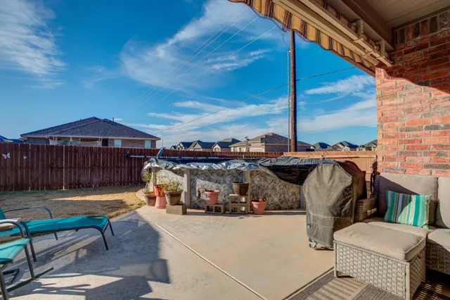 a view of roof deck with patio