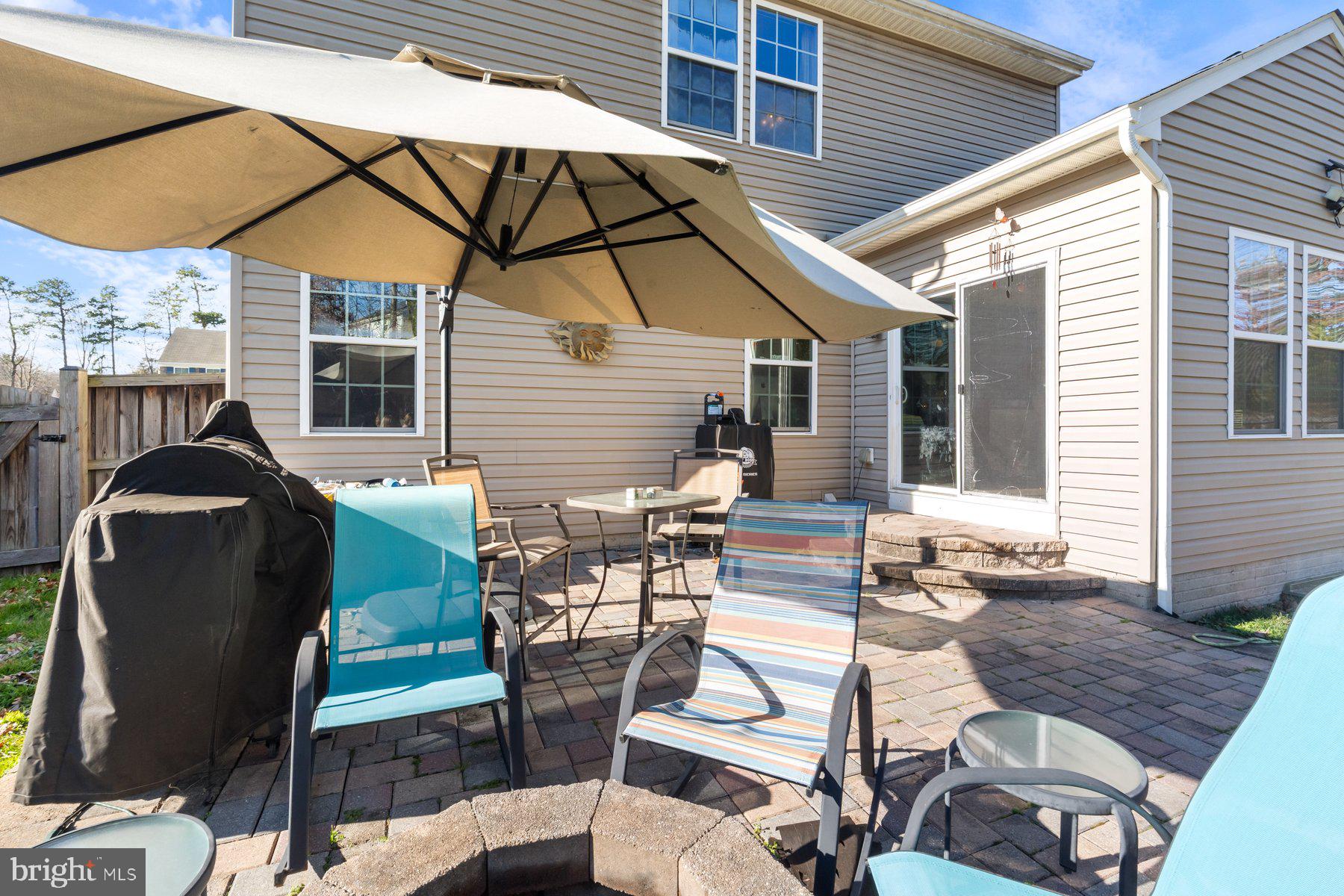 150 Cool Springs Road North East, MD 21901 - Photo 11 of 54 a view of a patio with table and chairs under an umbrella
