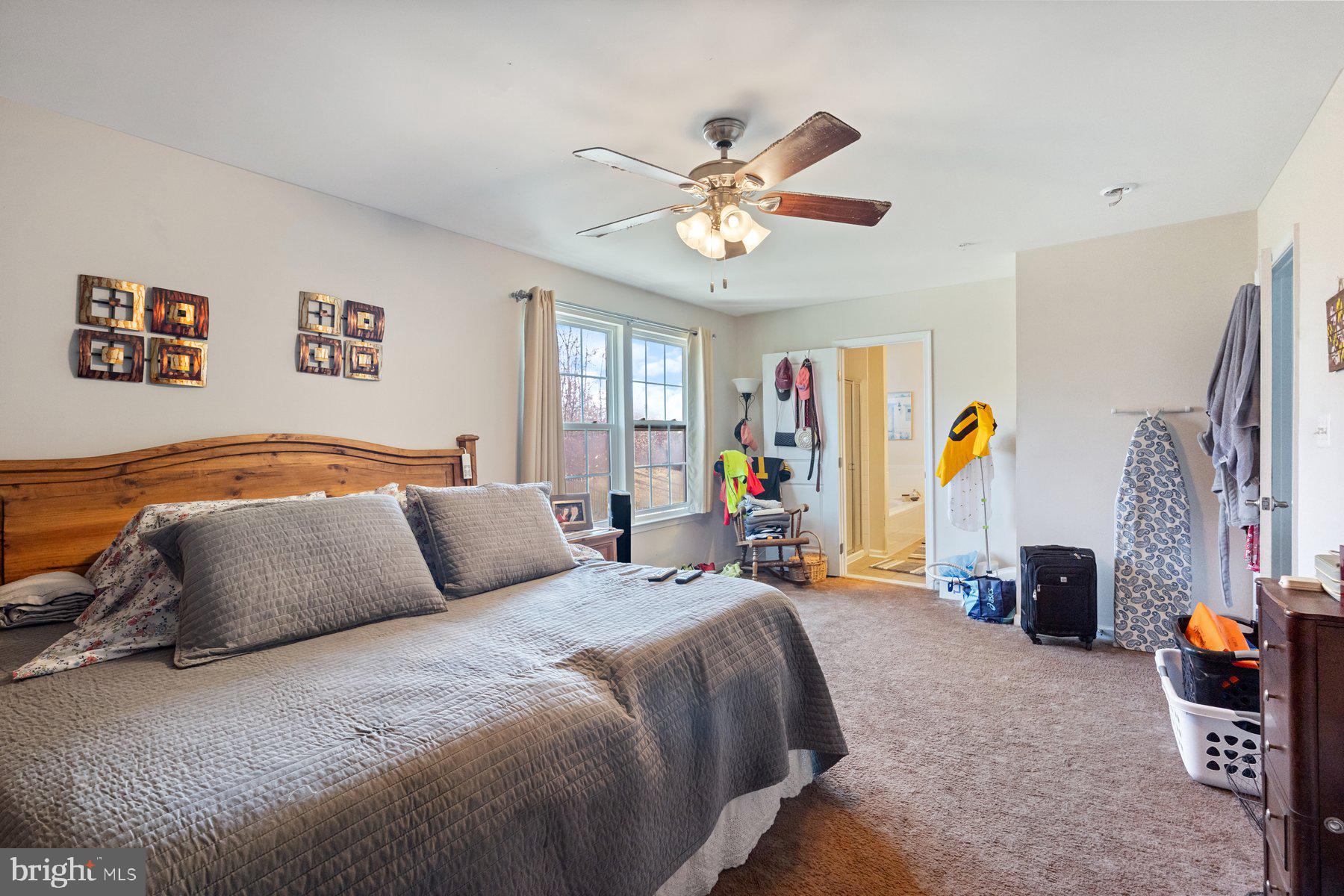 150 Cool Springs Road North East, MD 21901 - Photo 15 of 54 a bedroom with a bed and a chandelier