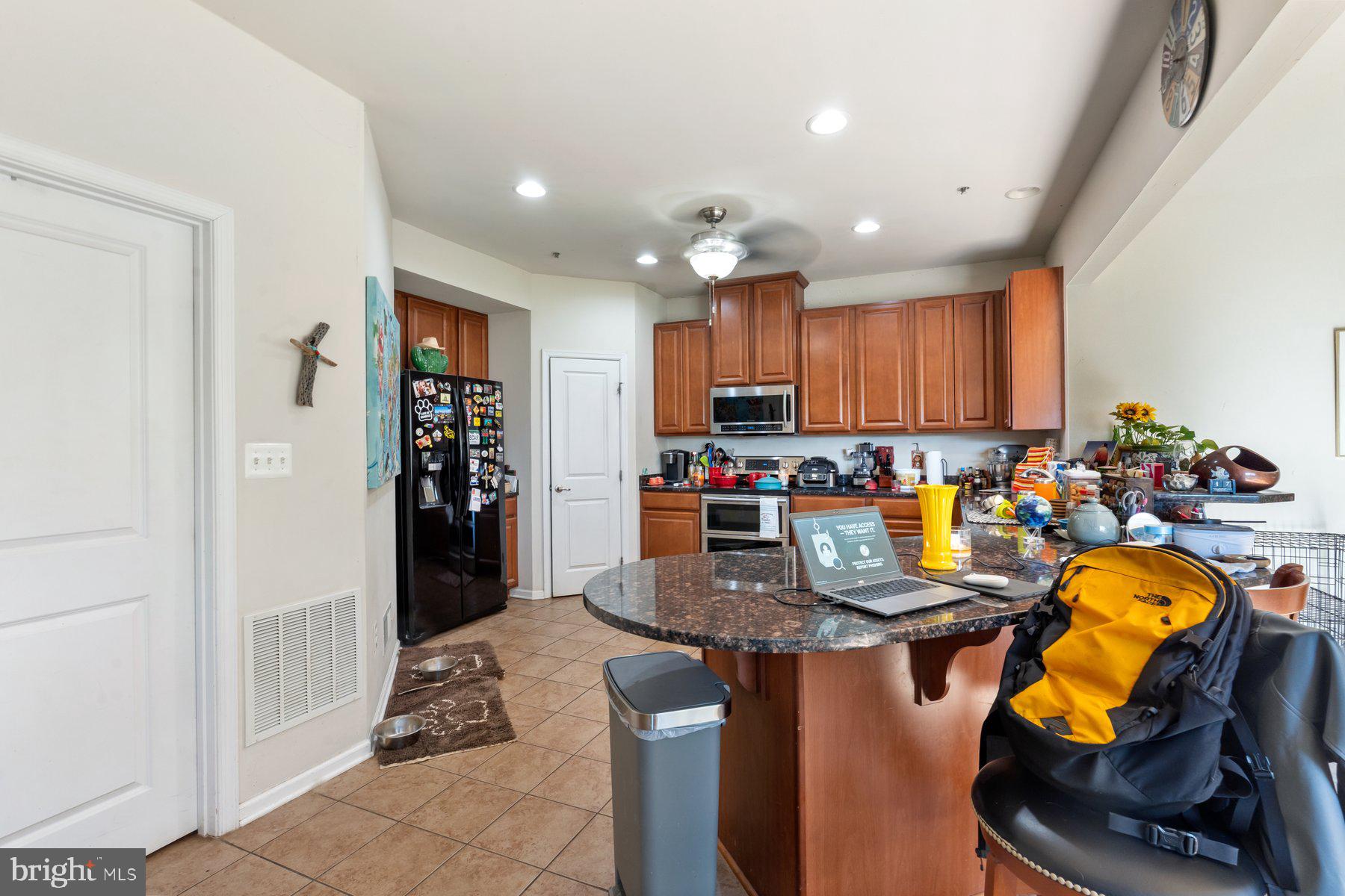150 Cool Springs Road North East, MD 21901 - Photo 35 of 54 a kitchen with sink refrigerator and chairs