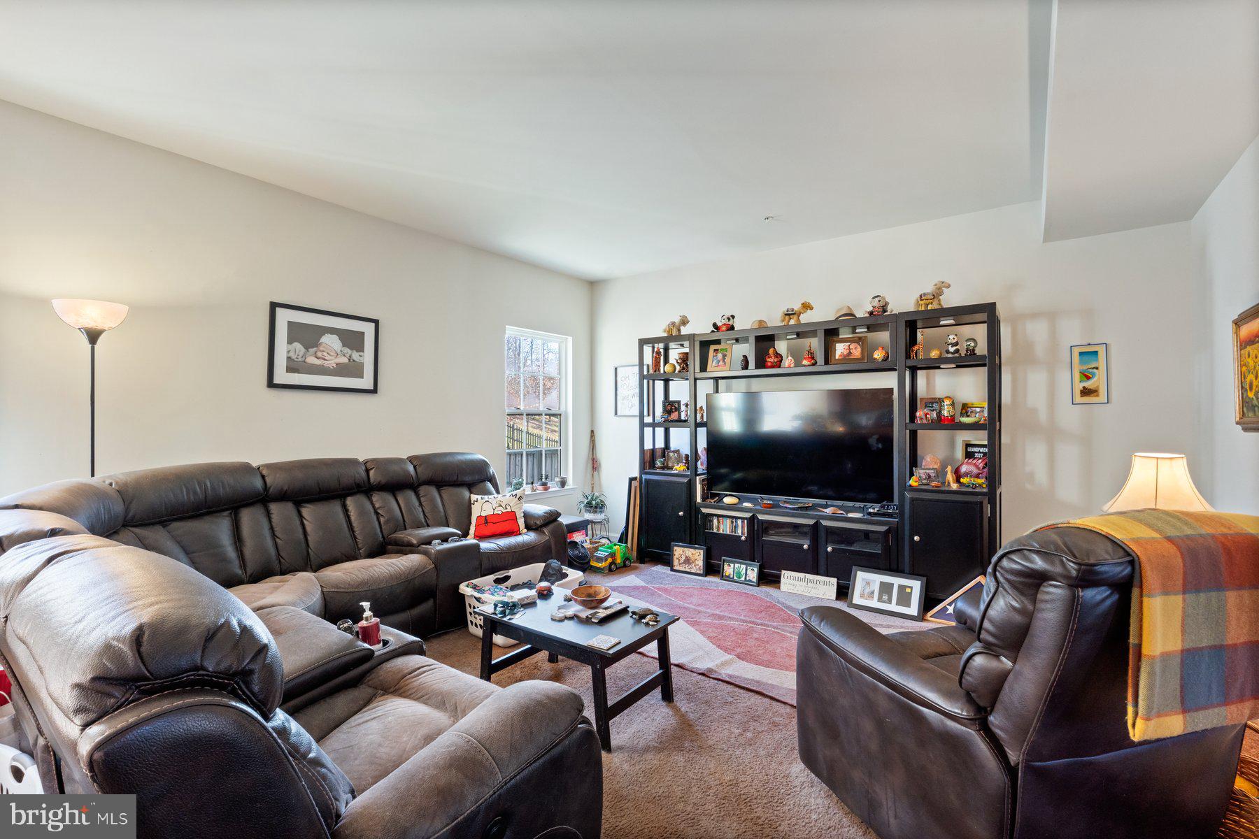 150 Cool Springs Road North East, MD 21901 - Photo 36 of 54 a living room with furniture and a flat screen tv