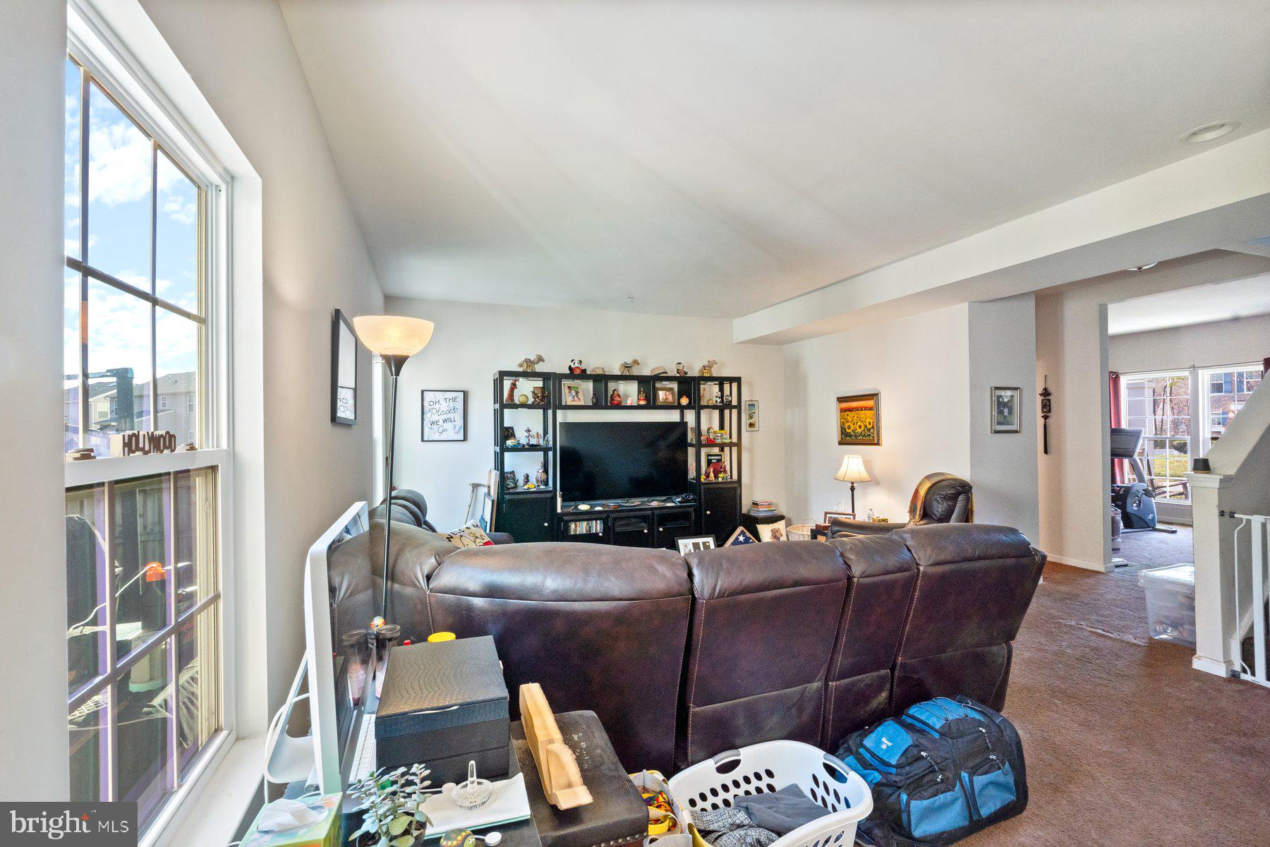 150 Cool Springs Road North East, MD 21901 - Photo 37 of 54 a living room with furniture a flat screen tv and a fireplace