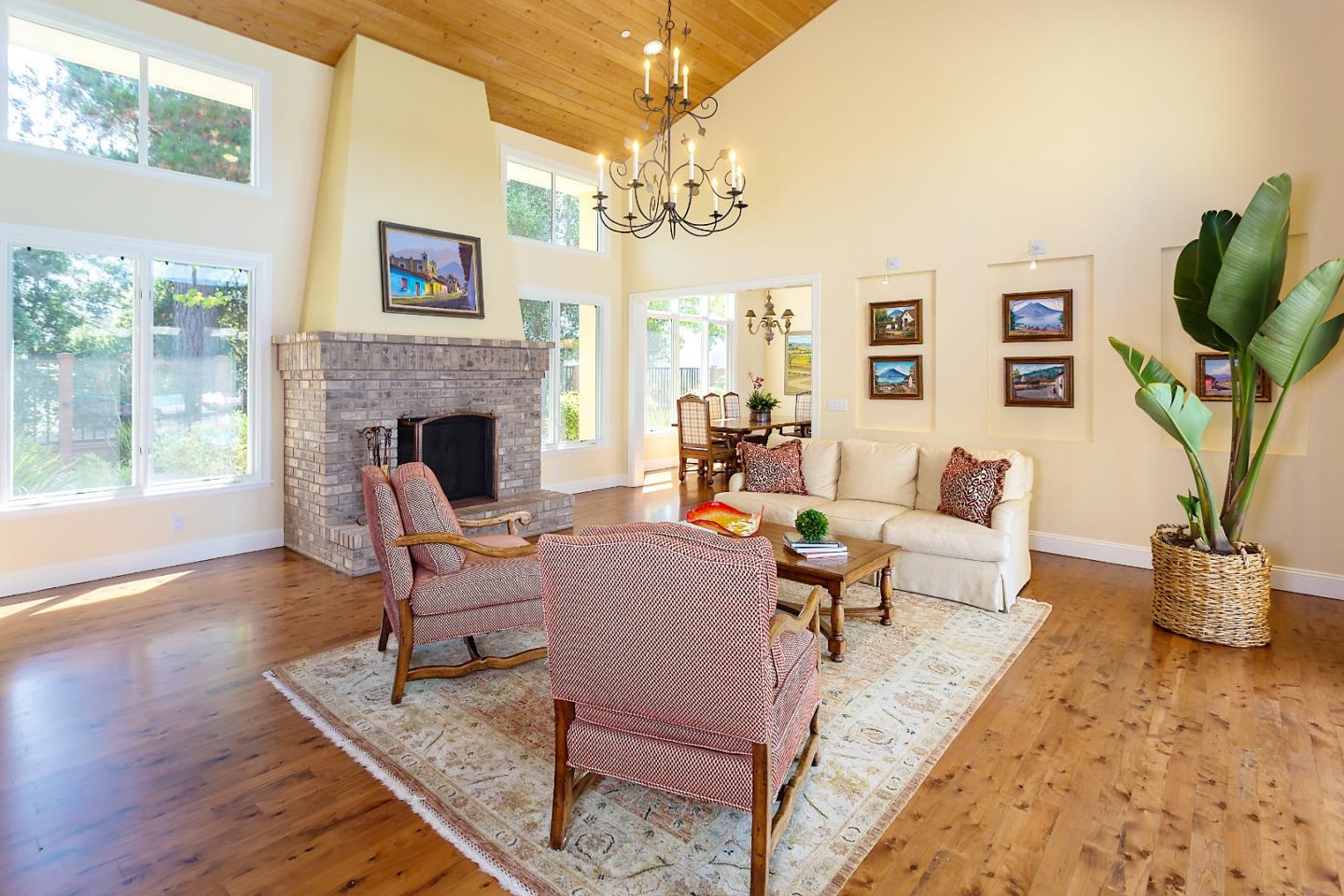 595 Day Valley Road Aptos, CA 95003 - Photo 8 of 37 a living room with furniture a chandelier and a fireplace