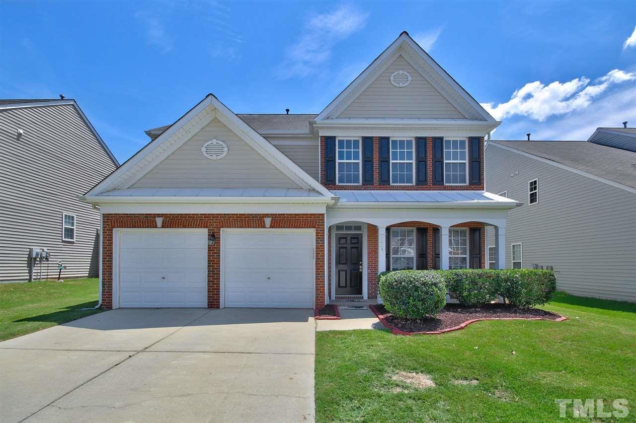 7444 Lagrange Drive Raleigh, NC 27613 - Photo 1 of 30 a front view of a house with a yard and garage