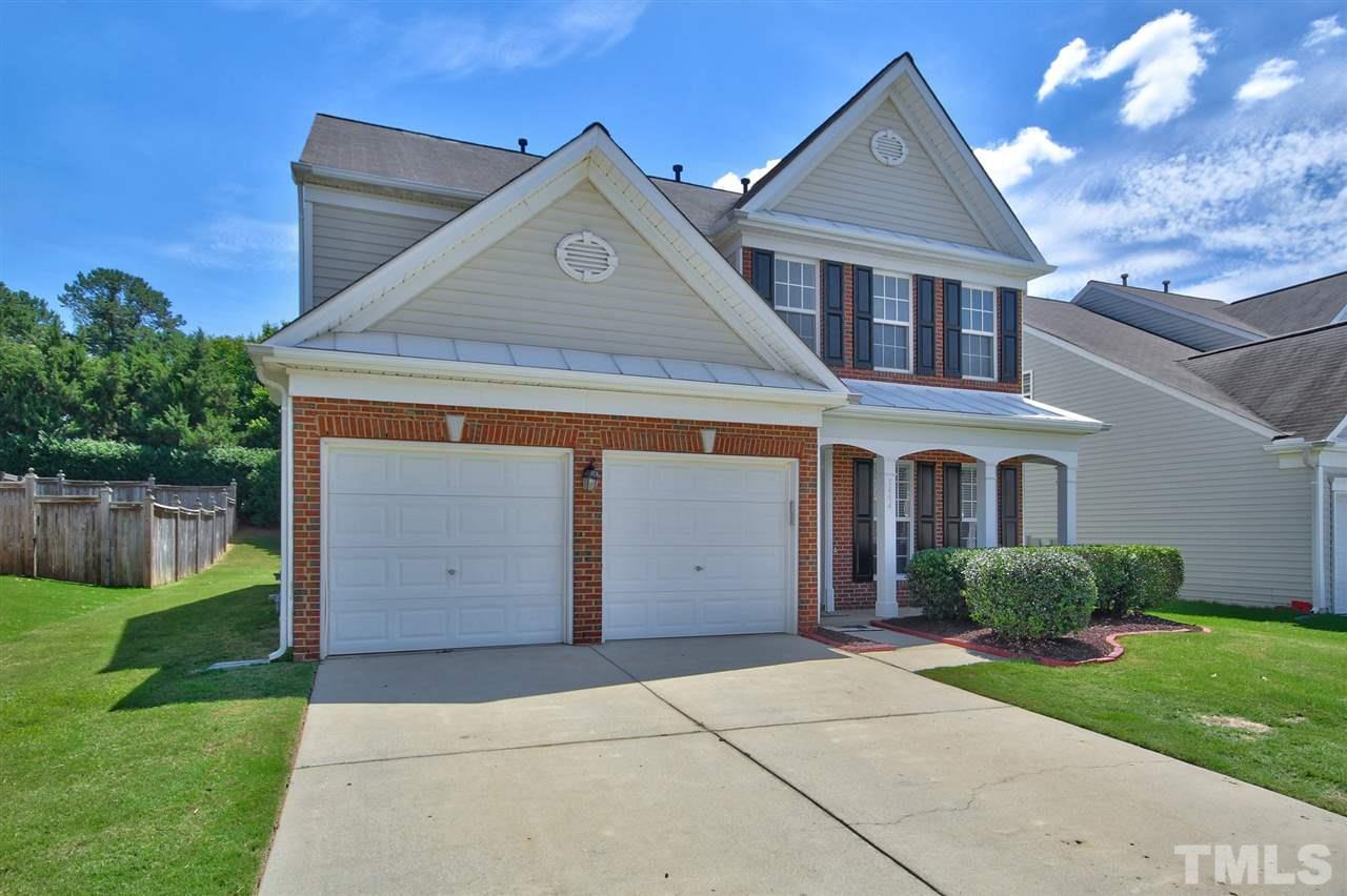 7444 Lagrange Drive Raleigh, NC 27613 - Photo 2 of 30 a front view of a house with a yard and garage