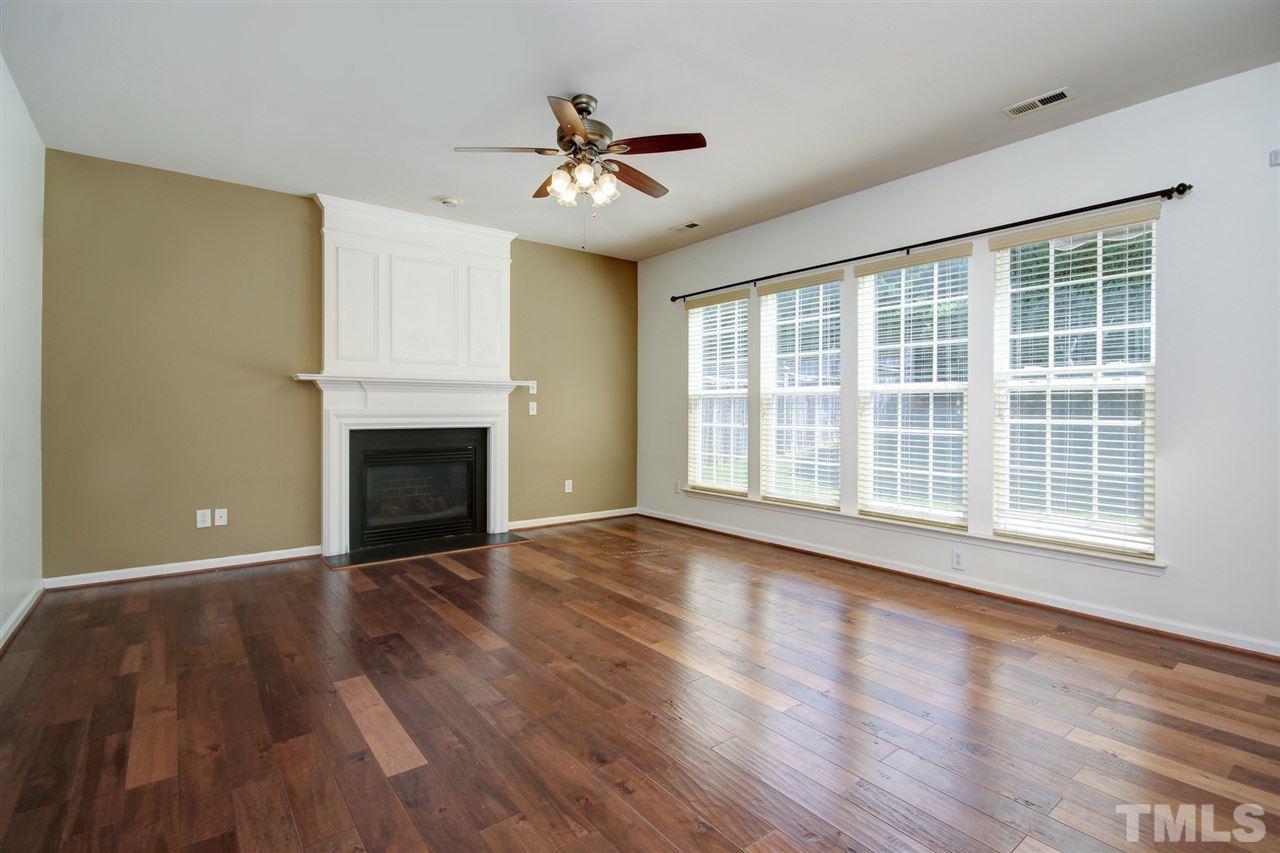 7444 Lagrange Drive Raleigh, NC 27613 - Photo 11 of 30 a view of an empty room with wooden floor and a window
