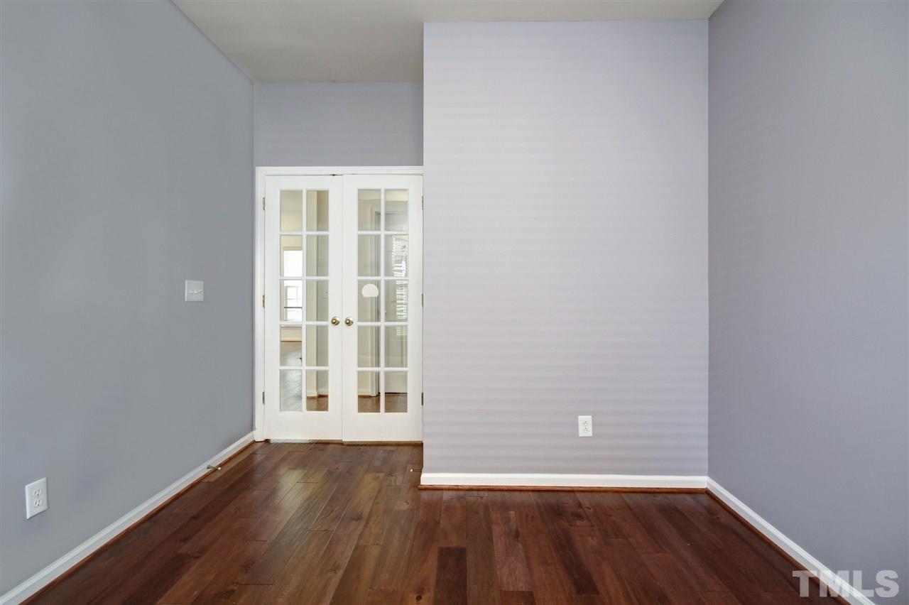 7444 Lagrange Drive Raleigh, NC 27613 - Photo 14 of 30 wooden floor and window in an empty room