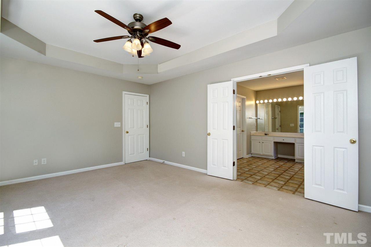 7444 Lagrange Drive Raleigh, NC 27613 - Photo 17 of 30 an empty room that has a window and a ceiling fan