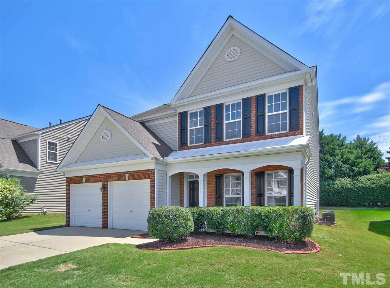 7444 Lagrange Drive Raleigh, NC 27613 - Photo 3 of 30 a front view of a house with a yard and garage