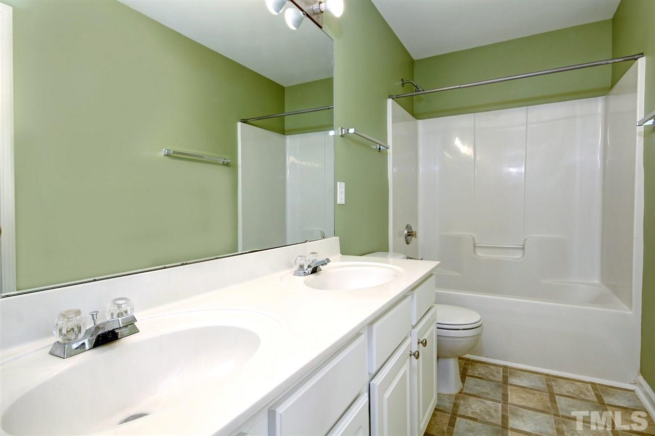 7444 Lagrange Drive Raleigh, NC 27613 - Photo 24 of 30 a bathroom with a sink and a mirror