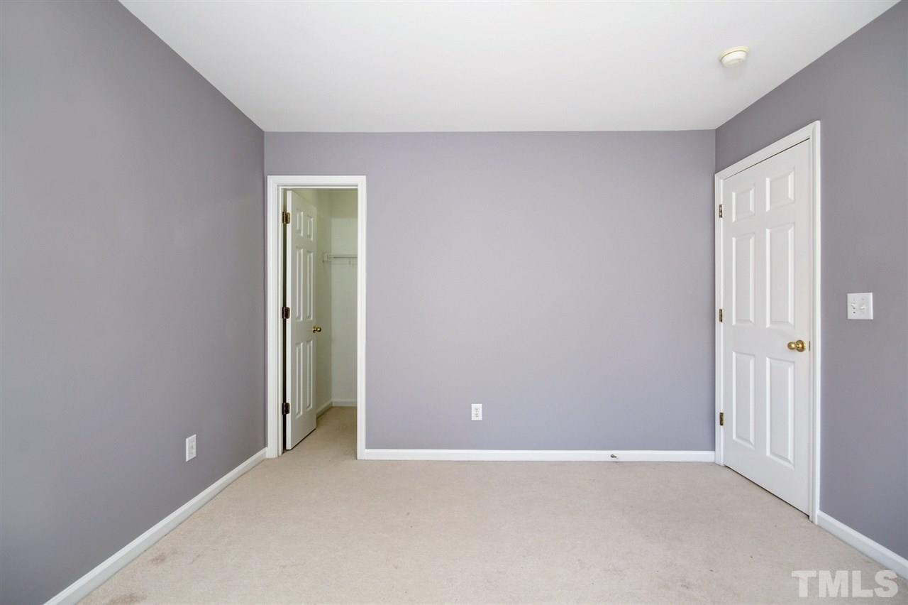7444 Lagrange Drive Raleigh, NC 27613 - Photo 26 of 30 an empty room with closet and a bathroom