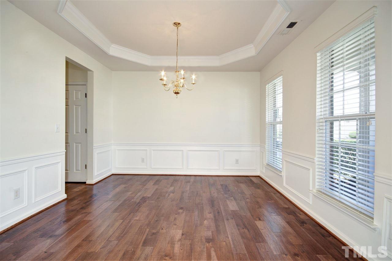 7444 Lagrange Drive Raleigh, NC 27613 - Photo 5 of 30 a view of empty room with wooden floor and fan