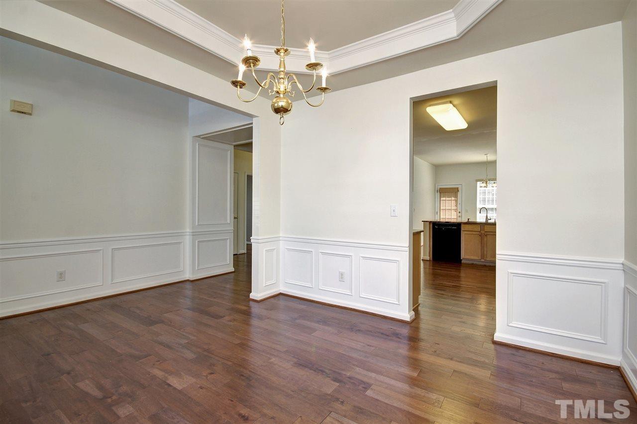 7444 Lagrange Drive Raleigh, NC 27613 - Photo 6 of 30 wooden floor in an empty room with a window