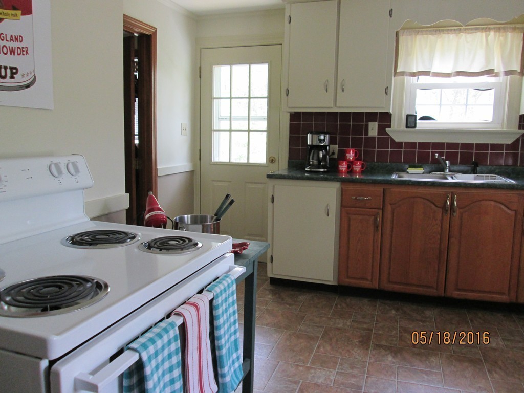 198 Ball Hill Road Princeton, MA 01541 - Photo 18 of 26 a kitchen with a stove a sink and a microwave