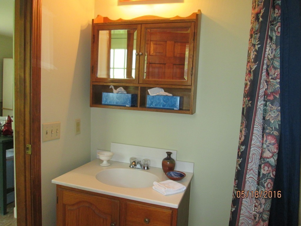 198 Ball Hill Road Princeton, MA 01541 - Photo 23 of 26 a bathroom with a sink and a mirror