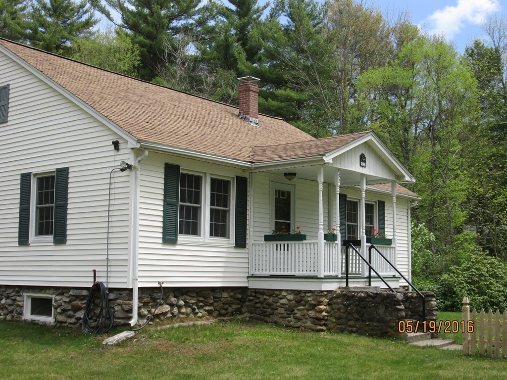 198 Ball Hill Road Princeton, MA 01541 - Photo 3 of 26 a front view of a house with a garden