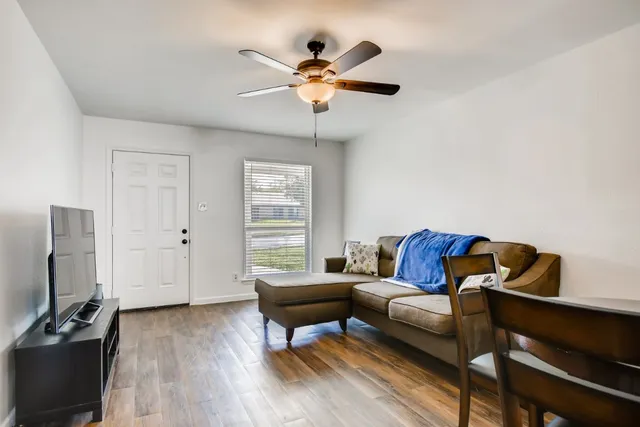 a living room with furniture and a window