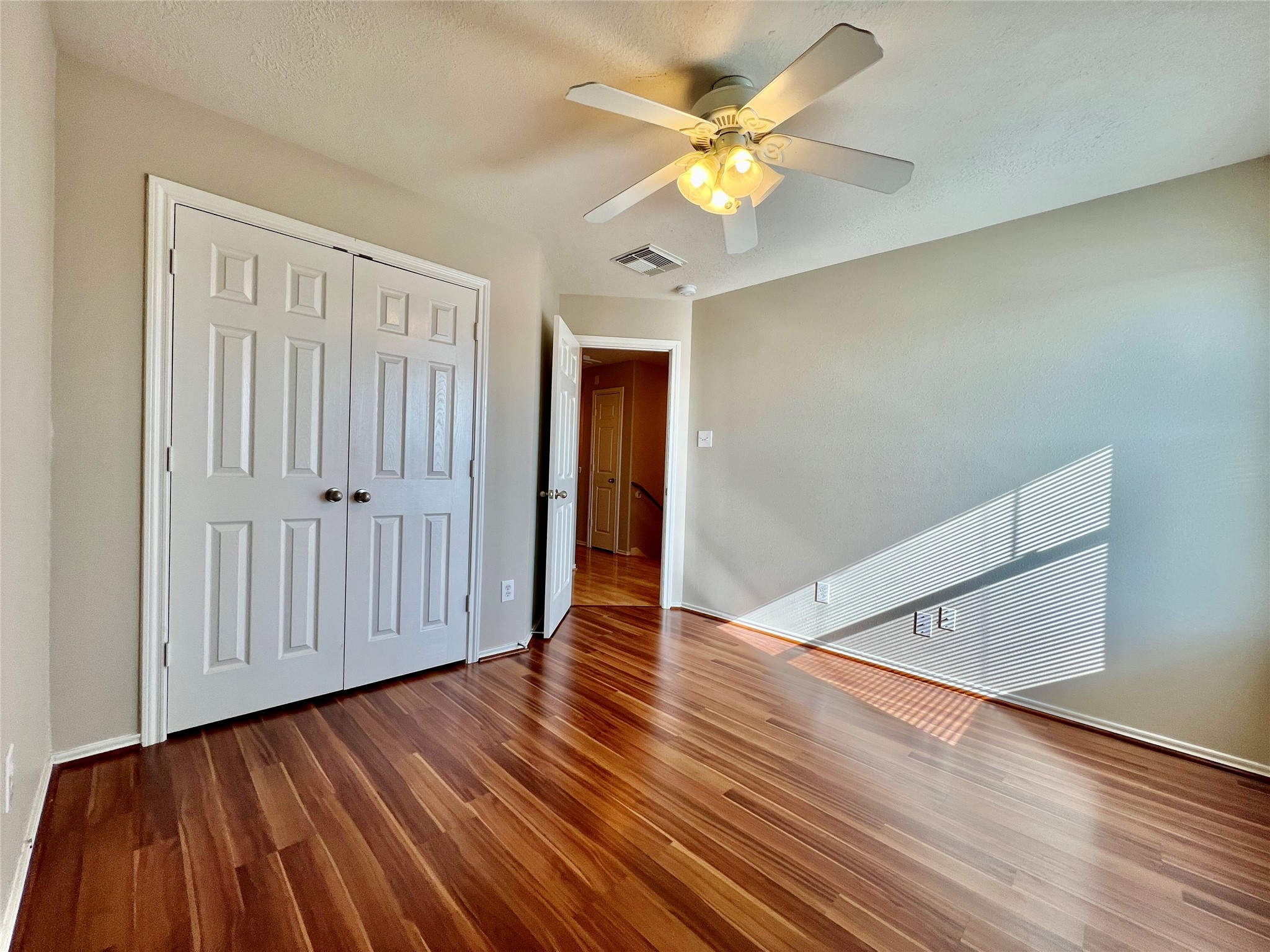 11834 Ramla Place Trail Houston, TX 77089 - Photo 17 of 30 a view of an empty room with wooden floor