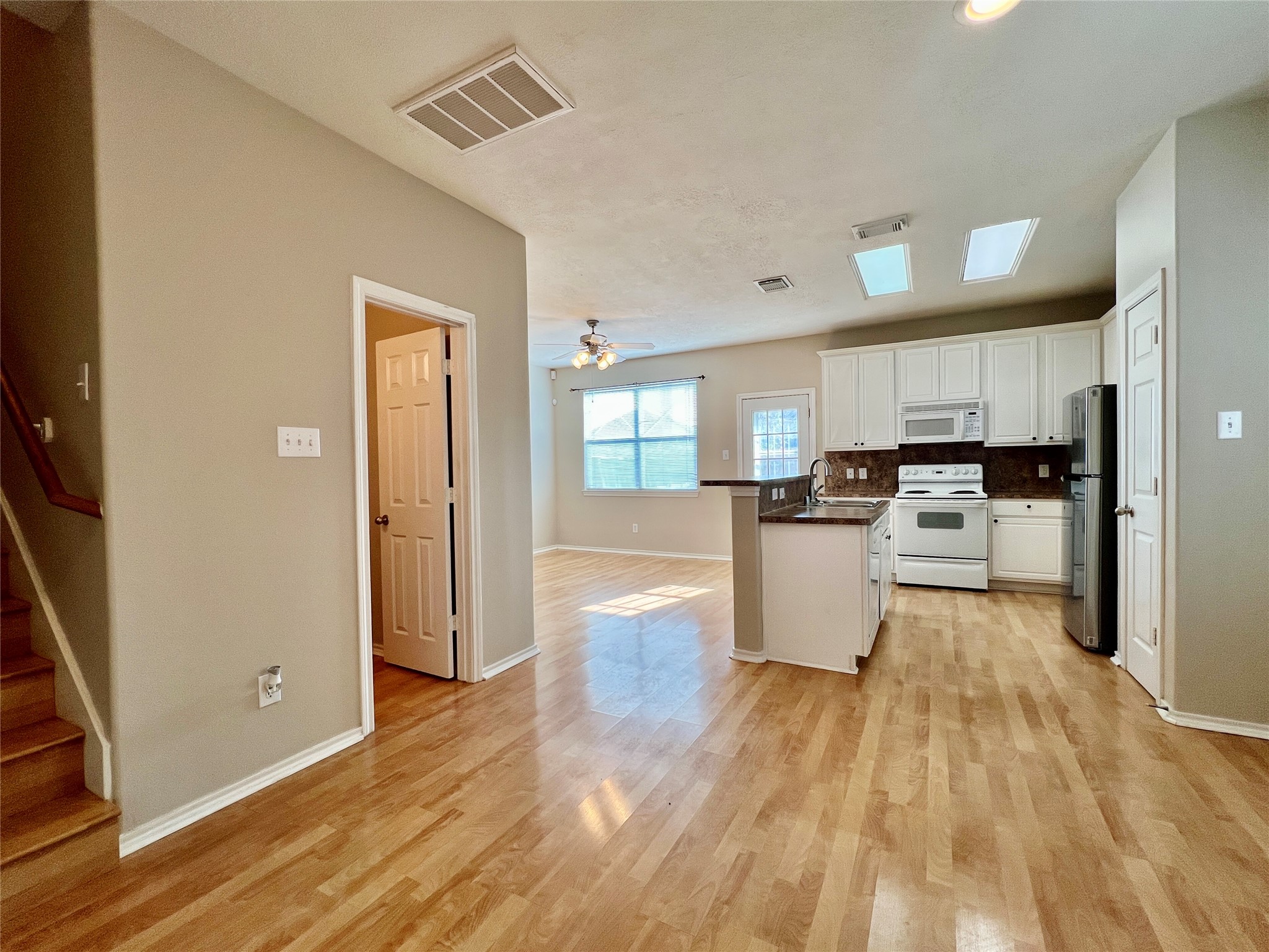 11834 Ramla Place Trail Houston, TX 77089 - Photo 5 of 30 a view of kitchen with wooden floor and electronic appliances
