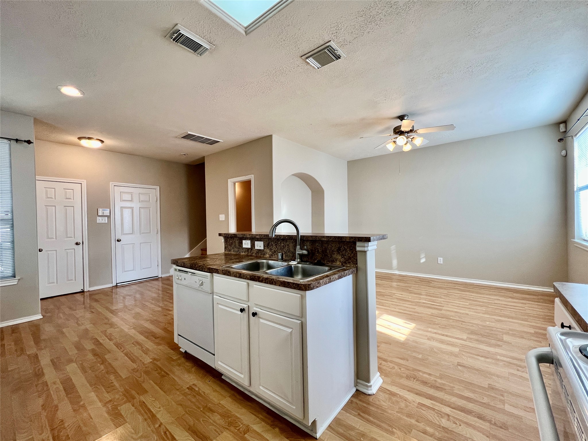 11834 Ramla Place Trail Houston, TX 77089 - Photo 6 of 30 a kitchen with granite countertop a sink cabinets and wooden floor