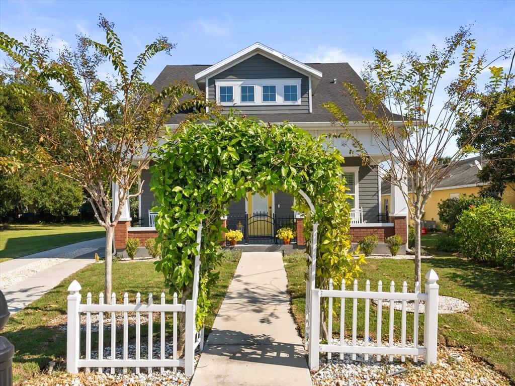 a front view of a house with garden