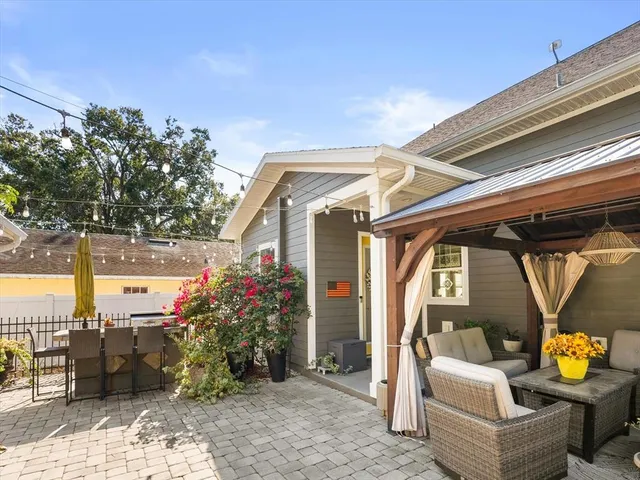 a view of a chairs and table in the patio