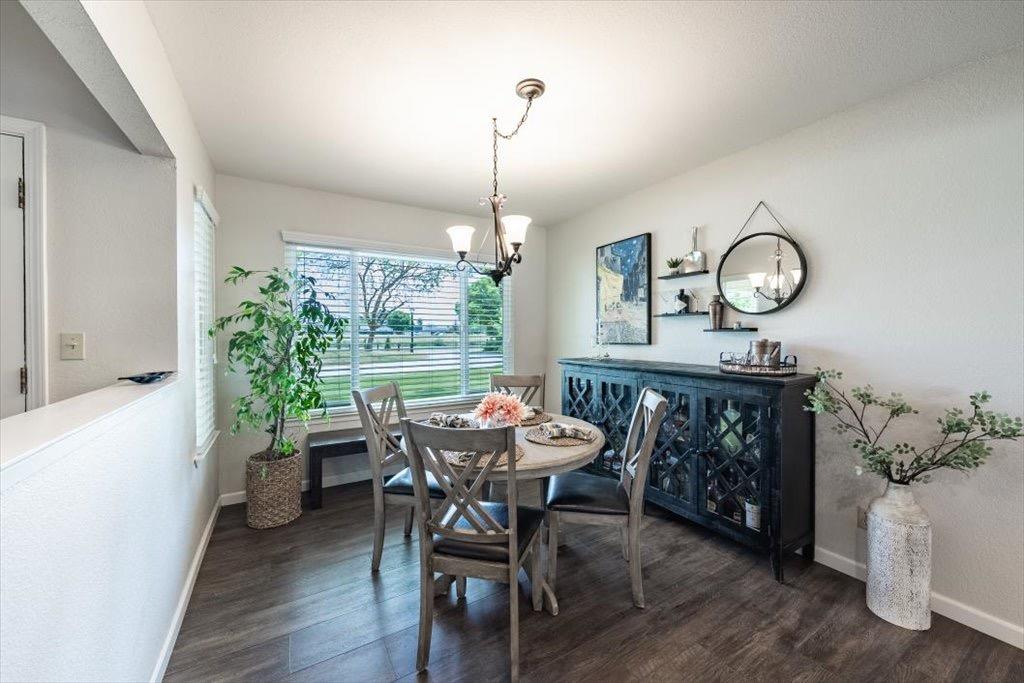 14066 Skyview Road Madera, CA 93636 - Photo 11 of 42 a view of a dining room with furniture window and wooden floor