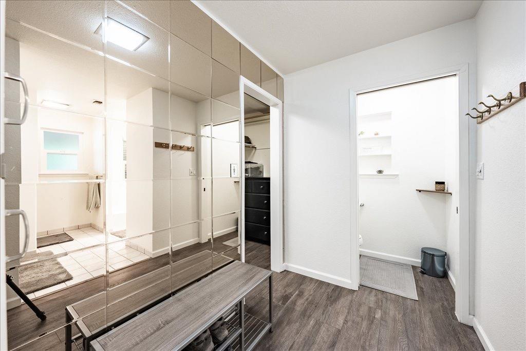 14066 Skyview Road Madera, CA 93636 - Photo 20 of 42 a living room with a bed and wooden floor