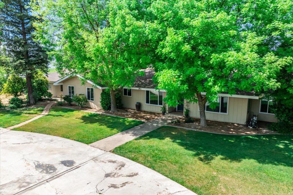 14066 Skyview Road Madera, CA 93636 - Photo 2 of 42 a front view of house with a garden