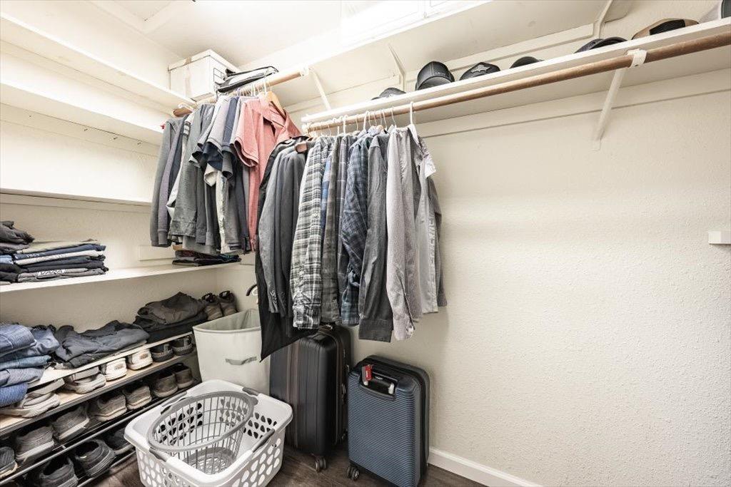 14066 Skyview Road Madera, CA 93636 - Photo 21 of 42 a view of walk in closet with clothes and shoes