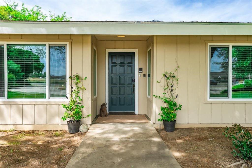 14066 Skyview Road Madera, CA 93636 - Photo 3 of 42 an entrance to house with potted plants