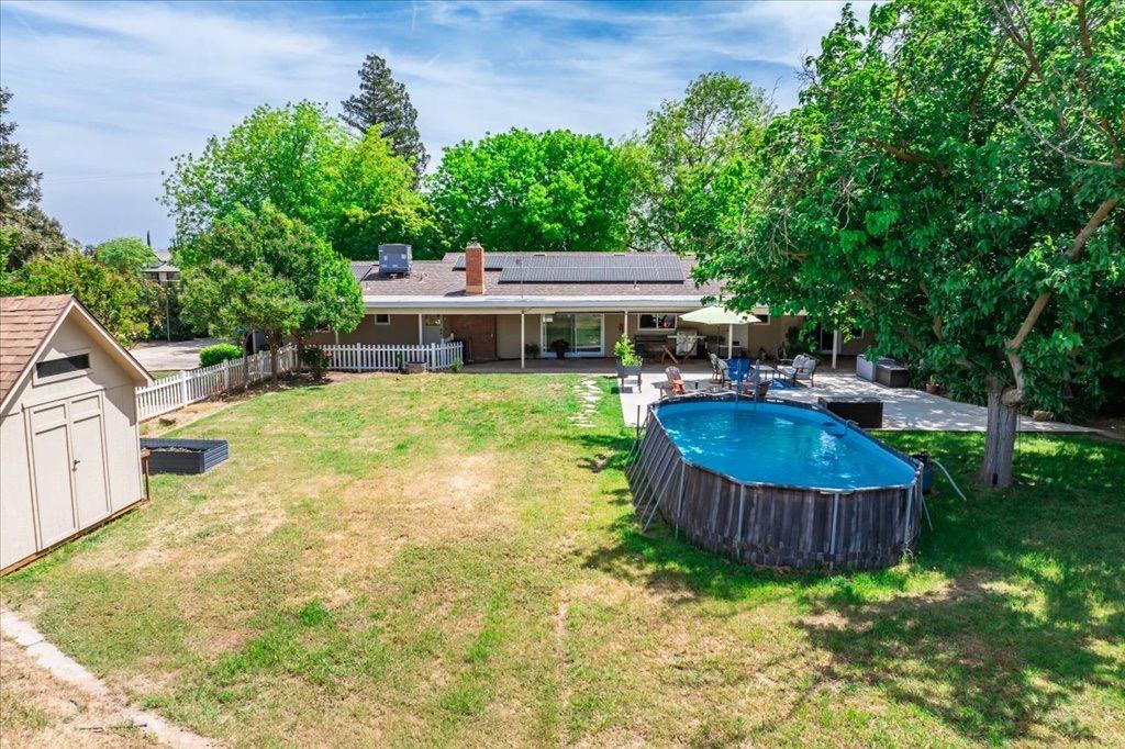 14066 Skyview Road Madera, CA 93636 - Photo 37 of 42 a view of a house with backyard swimming pool and sitting area