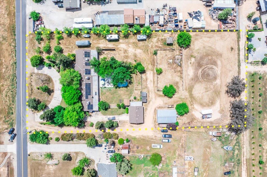 14066 Skyview Road Madera, CA 93636 - Photo 39 of 42 an aerial view of a house with a yard and garden