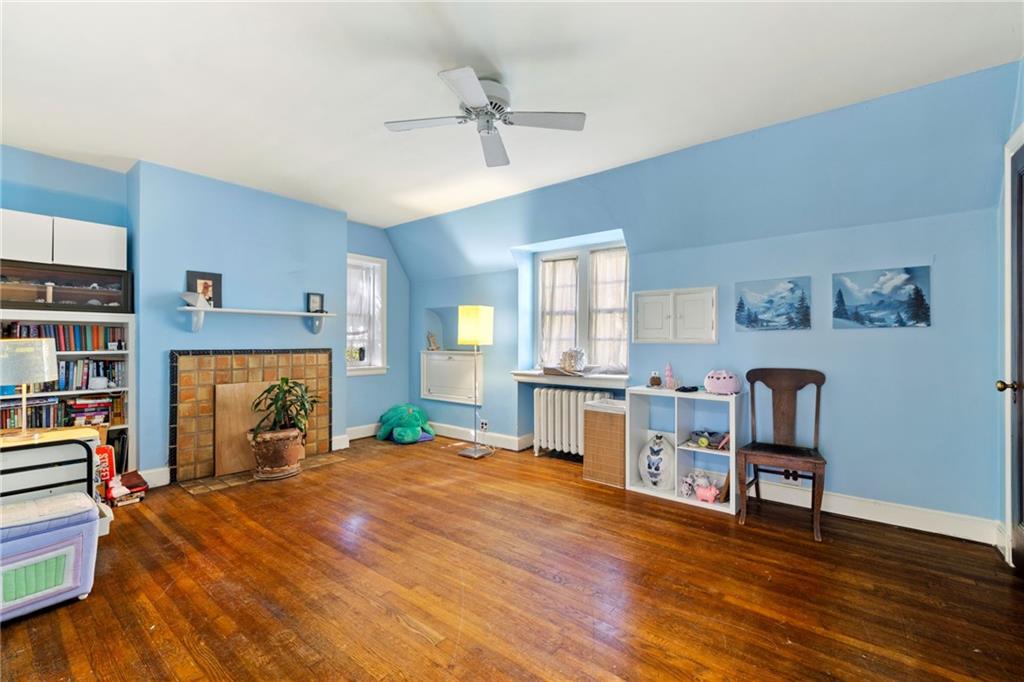 7008 Thomas Boulevard Pittsburgh, PA 15208 - Photo 14 of 23 a living room with furniture and a fireplace