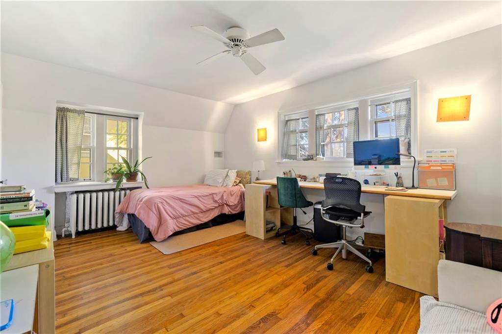 7008 Thomas Boulevard Pittsburgh, PA 15208 - Photo 15 of 23 a bedroom with a bed and a table in it