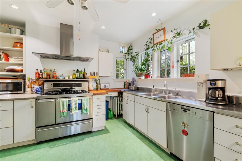 7008 Thomas Boulevard Pittsburgh, PA 15208 - Photo 6 of 23 a kitchen with a sink stove and cabinets