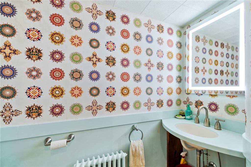 7008 Thomas Boulevard Pittsburgh, PA 15208 - Photo 9 of 23 a bathroom with a bathtub and a shower curtain