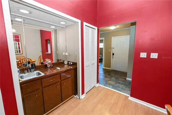 a bathroom with a sink and a mirror