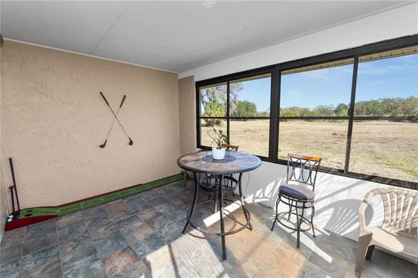 a view of a livingroom with furniture and window